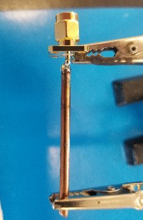 The copper probe soldered to the SMA pin.
