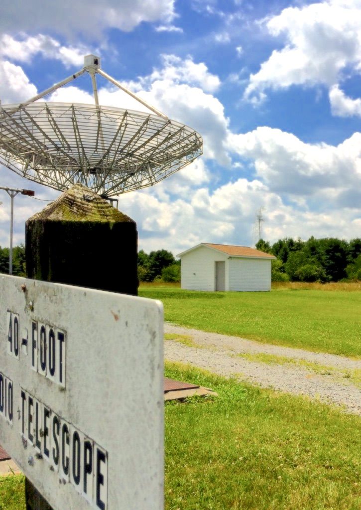 The 40 Foot telescope sign at the Green Bank Observatory with the dish standing behind it