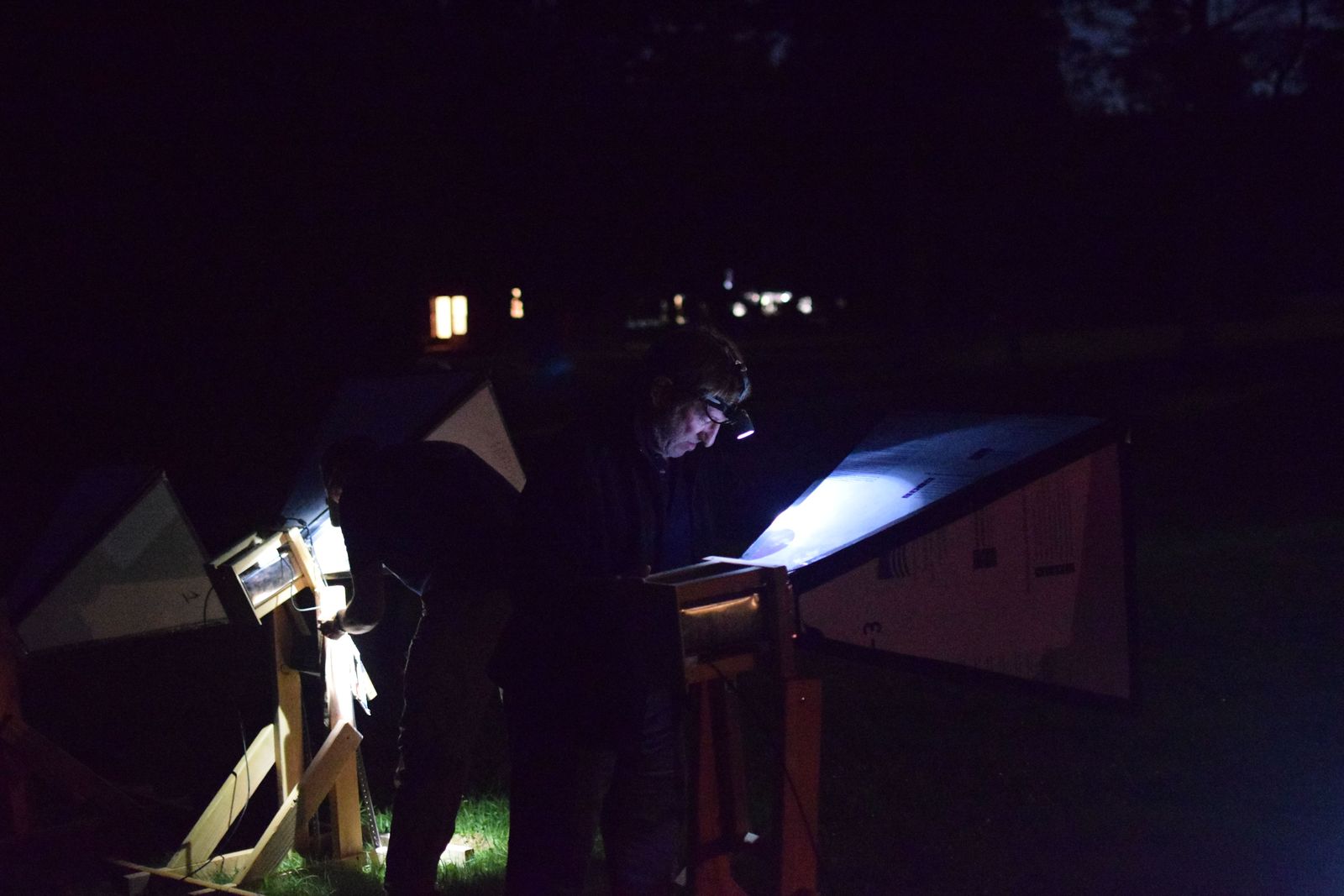 Horn antennas lit against the dark during a night-time observing run at Green Bank