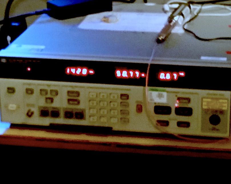 Bench test equipment in the WVU RF room showing a measurement on red LED displays